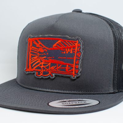 Tail’n Red Patch Snapback: Grey diecut patch with red Tail’n Red illustration embroidered, on charcoal grey flat brim with black mesh